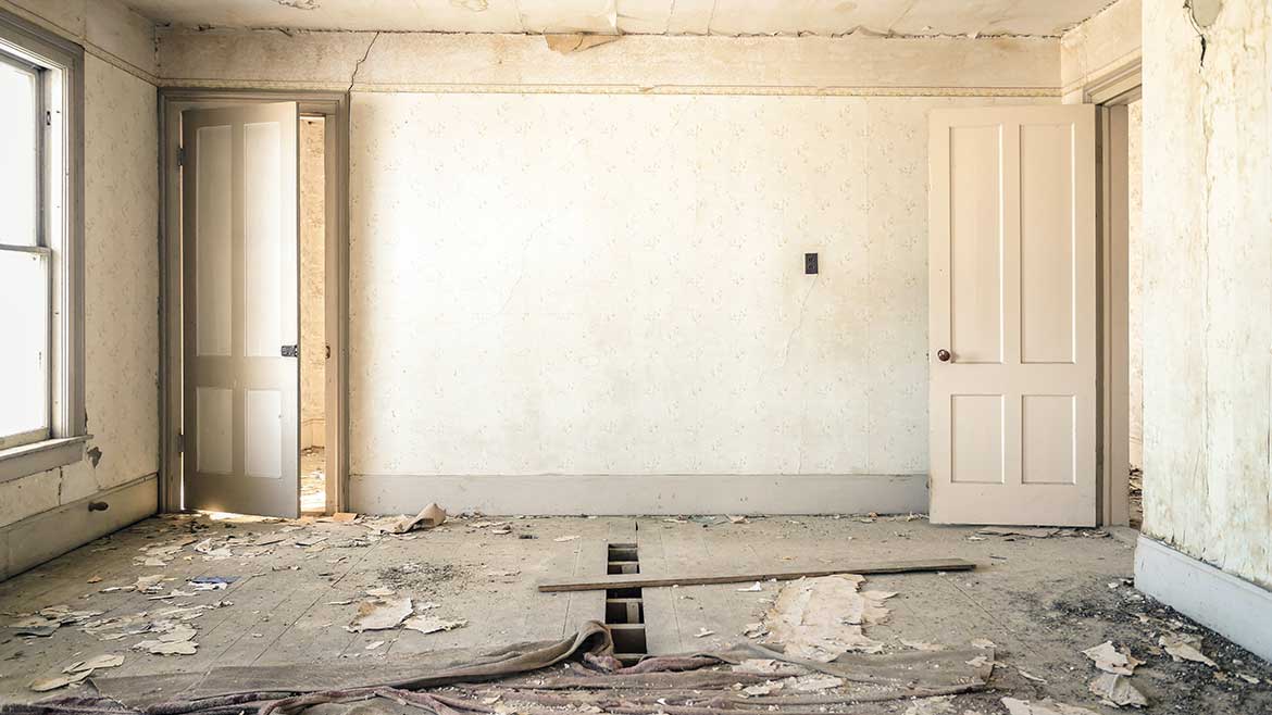 A room with some broken walls and a floor