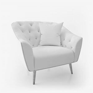 A white chair with pillows on top of it.