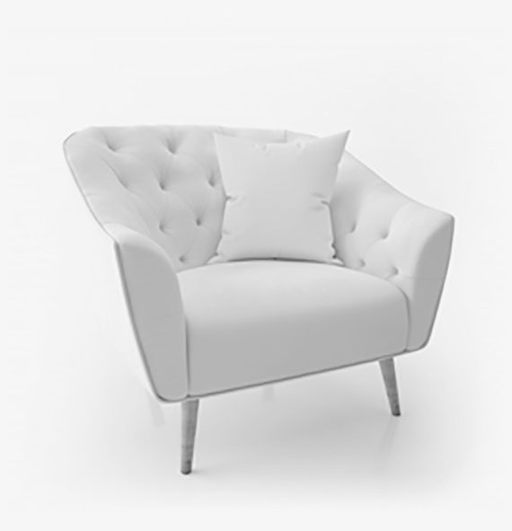 A white chair with pillows on top of it.