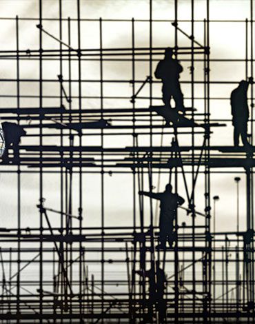 A group of men working on scaffolding.