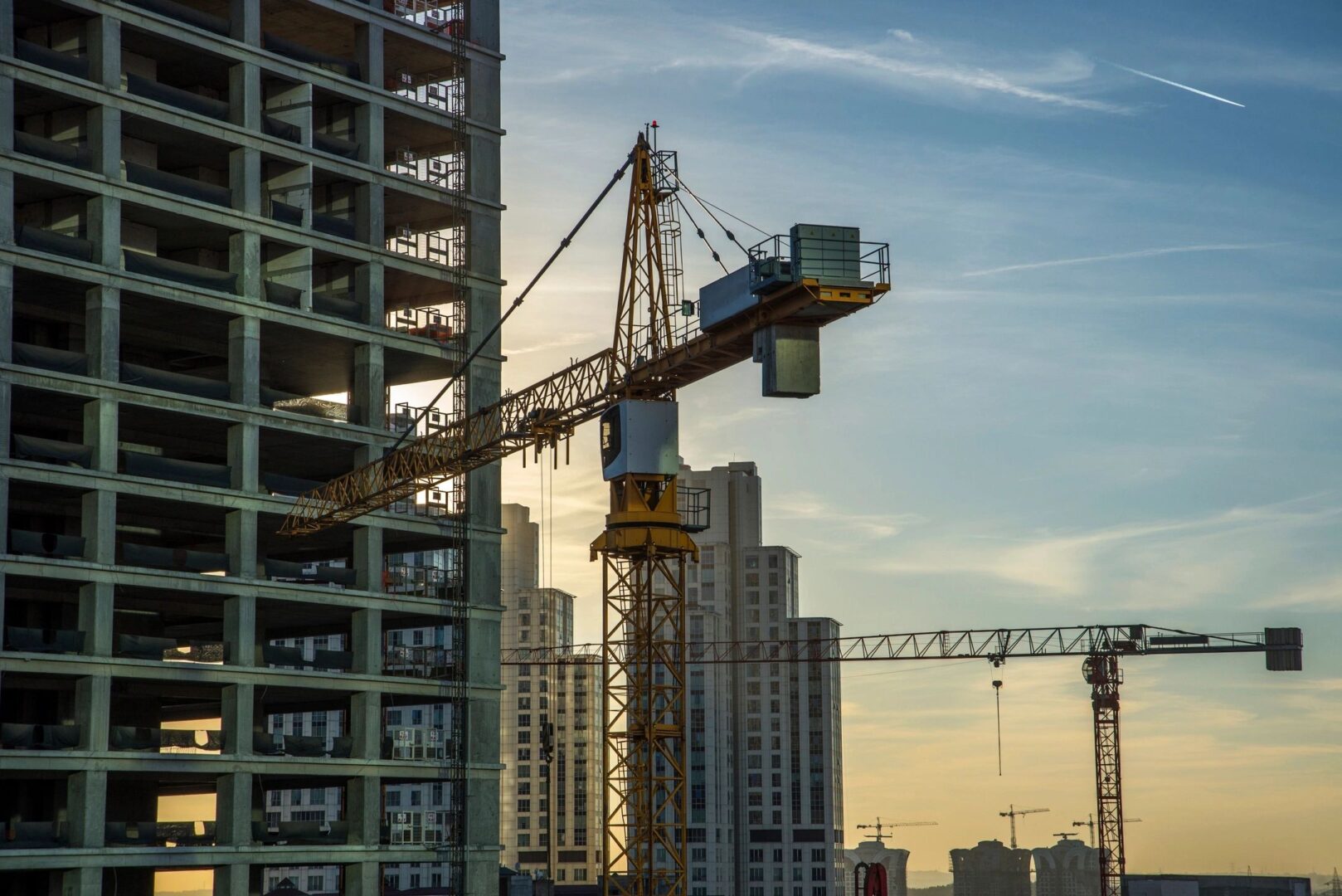 Construction crane and building under construction.